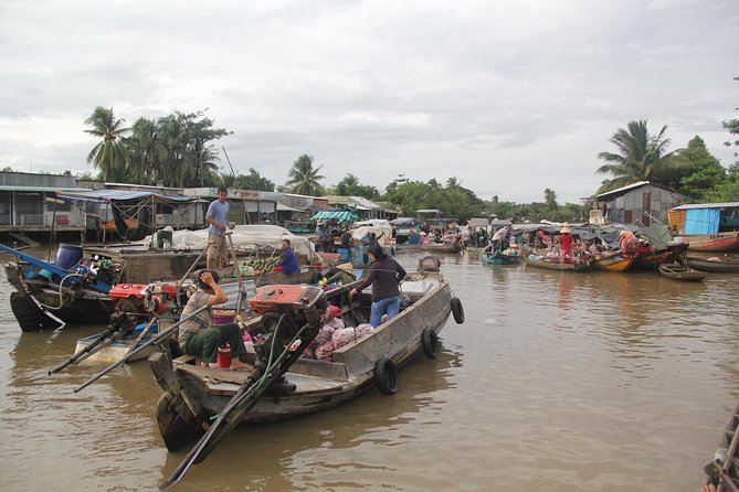 1-day Mekong Delta Tour: Cai Be Market, Local Island and Cycling - Cai Be Floating Market in Cai Be: Produce, Boats, and Real Trade