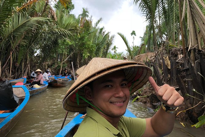 CuChi Tunnels&Mekong Delta-Boat,TukTuk,Coconut Village SmallGroup - Motorboat, rowing boat, and a traditional music performance