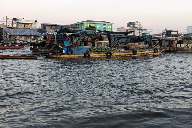 Deluxe Mekong Delta Tour to Floating Market 2 Days 1 Night Trip - My Tho boat ride: fish cages, floating homes, and quiet canals