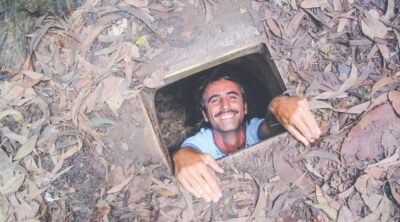 Ho Chi Minh City: Cu Chi Tunnels and Gun Shooting Experience - Guided tunnel tour: crawling, trapdoors, and the Hoang Cam kitchen