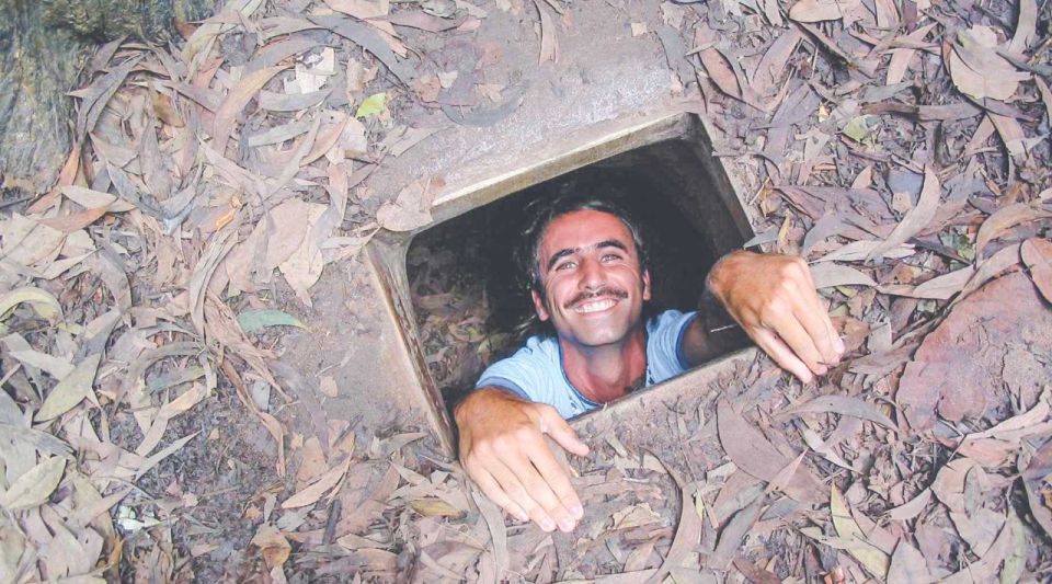 Ho Chi Minh City: Cu Chi Tunnels and Gun Shooting Experience - Guided tunnel tour: crawling, trapdoors, and the Hoang Cam kitchen