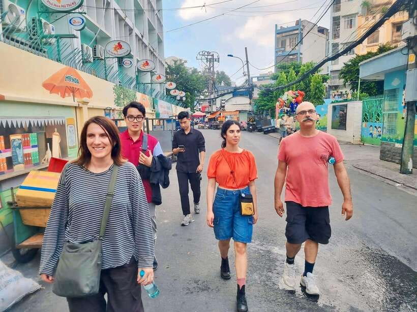 Ho Chi Minh City: Food Tastings & Sightseeings On Scooter - District 3 street stops and the Nguyen Thien Thuat Apartment Park pause