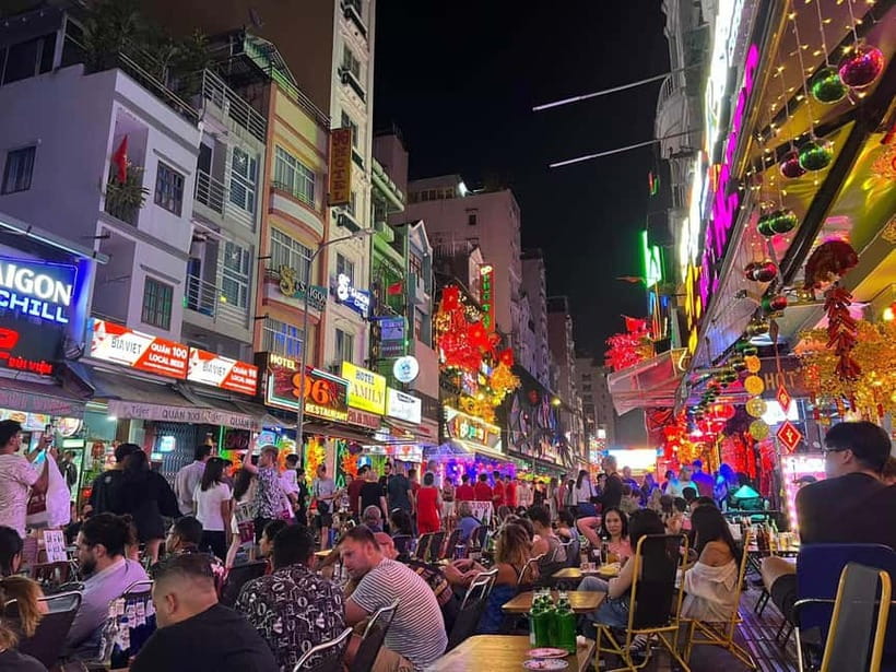 Ho Chi Minh City: Night Walking Tour with Hidden Gem Stop - Entering Nguyễn Huệ Walking Street: lights, angles, and quick context