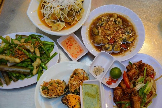 Ho Chi Minh Nightlife & Street Food Tour By Motorbike - Ho Thi Ky Flower Market after dark: photos first, then snacks