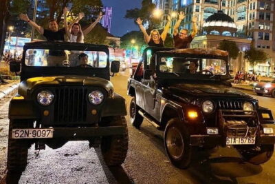 Jeep Tour Saigon By Night : FRESH SEAFOOD, STREET FOOD & SKY BAR - Nguyen Hue Street kickoff: lights, people, and a first orientation