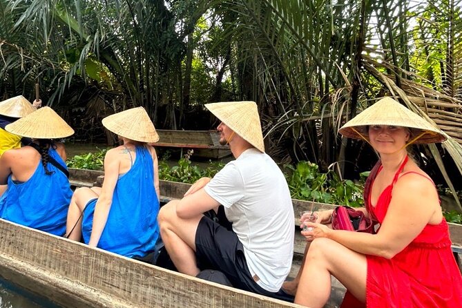 Mekong Delta Guided Tour from Ho Chi Minh City - Row boat through the smaller canals and Ben Tre’s coconut kingdom