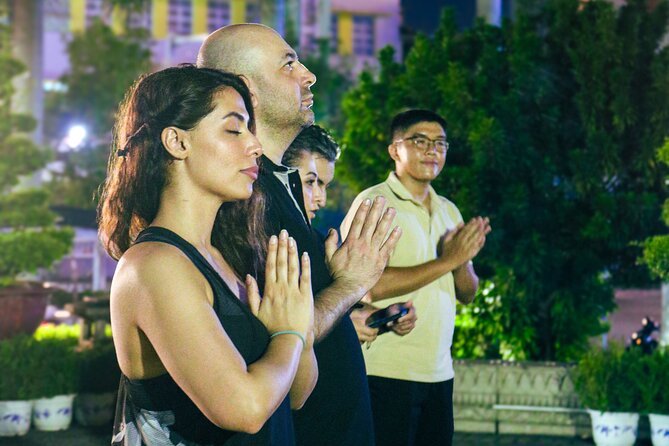 Private Discover Saigon Hidden Spots on Night Motorbike Adventure - District 10 snack break: Vietnamese baguette, beers, and a quick reset