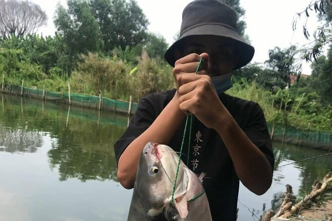 Private Full-Day Ho Chi Minh City Fishing Adventure - Meeting in District 1 and getting to the fishing outskirts