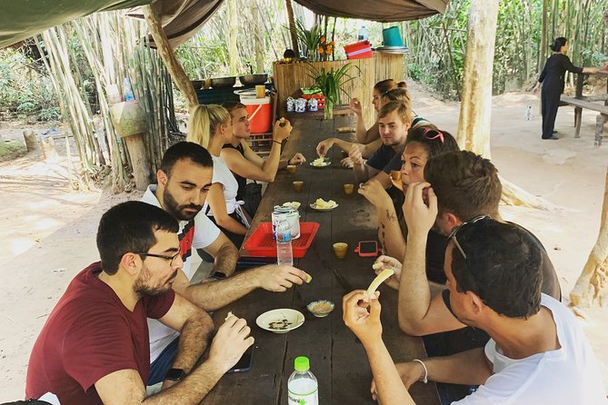 Private War Veteran CuChi Tunnels 1/2 Day Tour - Inside the Cu Chi Tunnels: crawl time and the Hoang Cam kitchen experience