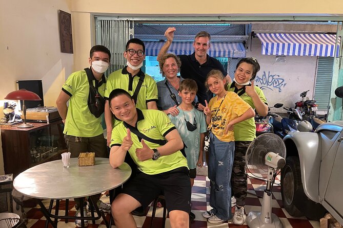 Saigon By Night and Street Food By Motorbike | Opt: Ao Dai Riders - Pickup at 5:30, then the ride setup: helmets, ponchos, and Ao Dai riders