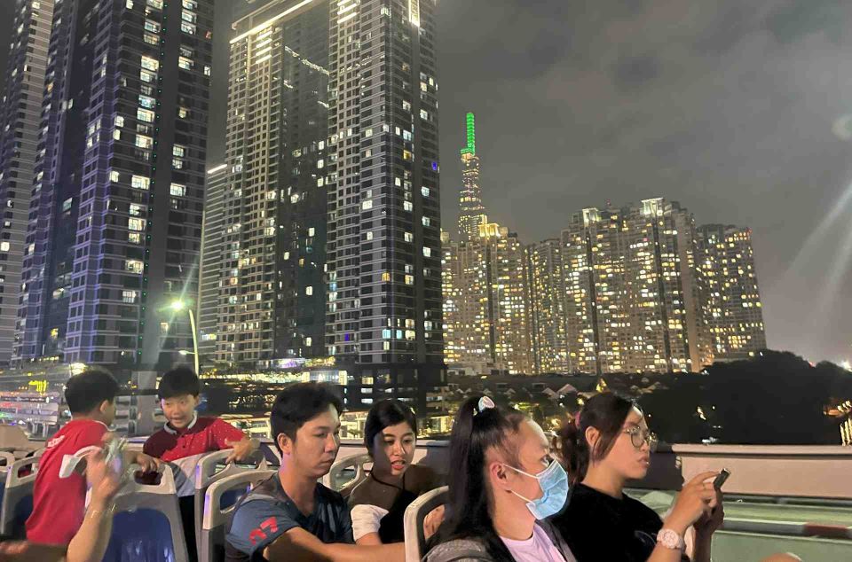 Saigon: City Sightseeing Hop-On Hop-Off Bus Tour - Blue Route: pagodas, flower market energy, and District 5 scenery