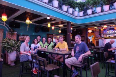 Saigon: Night Craft Beer And Street Food Tour By Vespa - Rooftop sunset stop: beers with city views