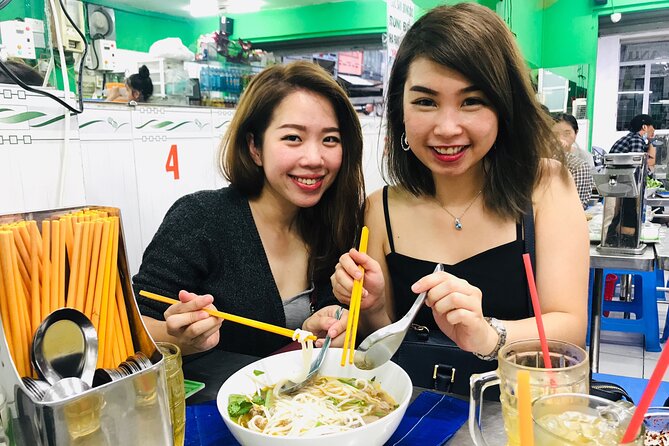 Saigon Night Scooter Experience And Local Food - Flower market, District 7 wealth, and a photo-friendly bridge walk