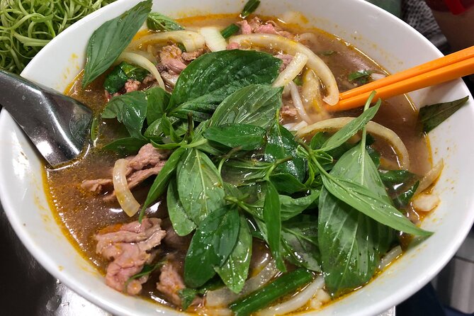 Saigon Night Scooter Experience And Local Food - Stop-by-stop: District 3 vibes and the Hue noodle soup anchor